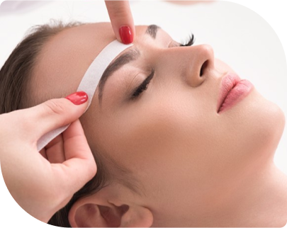 Woman receiving a professional eyebrow waxing service at Facials & Skincare by Debbie in Orange County, CA.