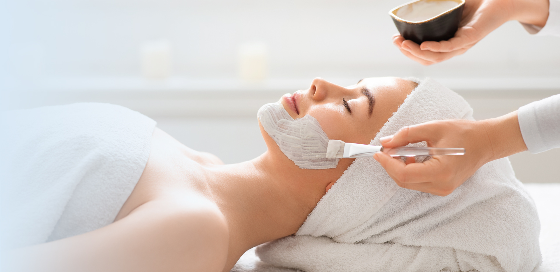 Esthetician in Orange, CA applying a facial treatment during one of the best facials in Orange County.