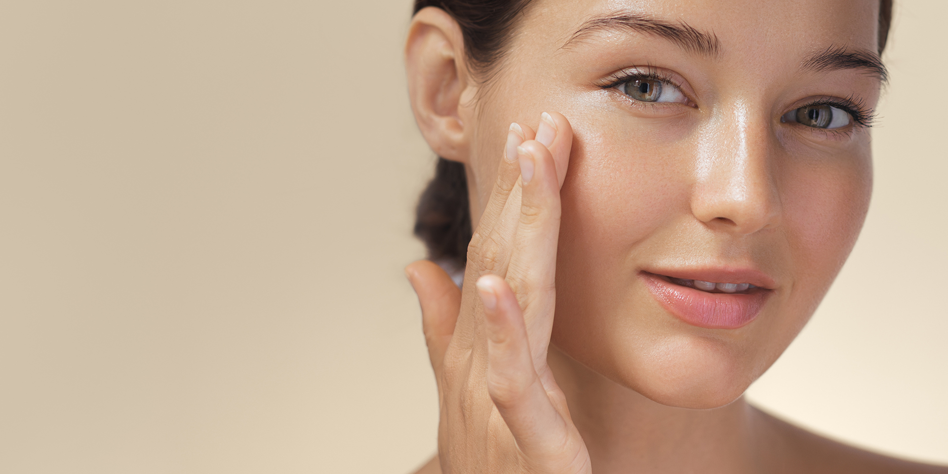 Glowing Skin After Chemical Peel Treatment Woman touching smooth, glowing skin after chemical peel treatment in Orange, CA