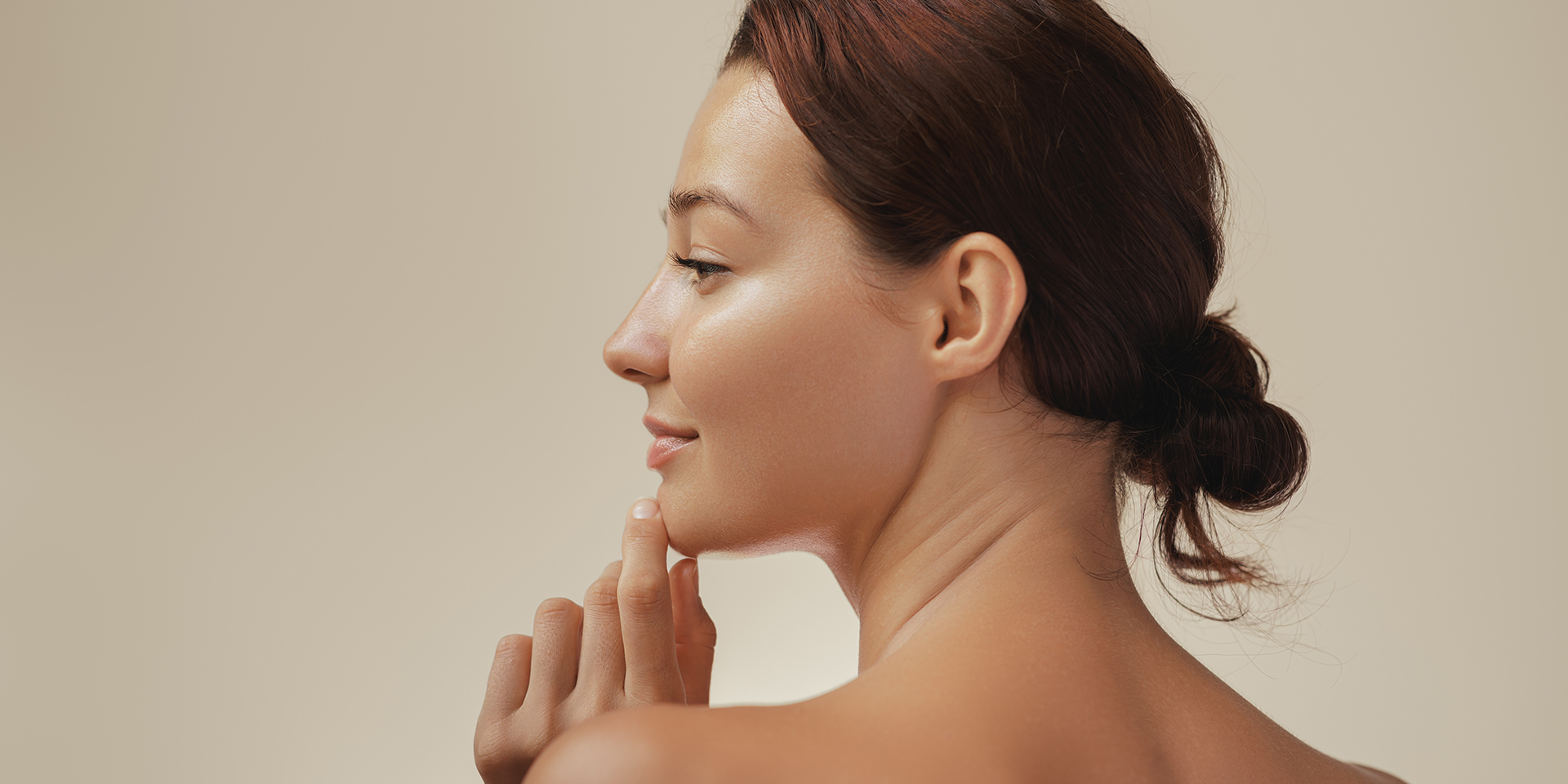 Best Esthetician in Orange CA – Skincare by Debbie Profile view of a woman with radiant skin after visiting the best esthetician in Orange, CA